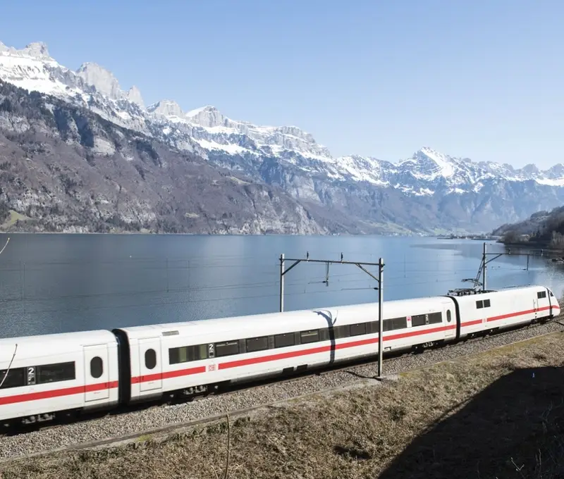 Passenger train traveling along a rail corridor